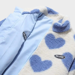 Veste réversible : côté polaire crème à cœurs bleus, intérieur bleu clair