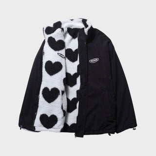 Veste réversible Manuela: côté extérieur noir, doublure polaire à cœurs, zip devant