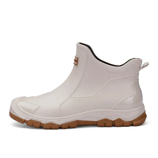 Bottines à enfiler blanches à bout fermé, semelle crantée, semelle brun.