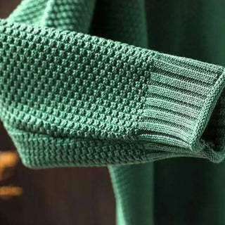 Manche de pull en cachemire Amara vert avec bord-côte et tricot texturé