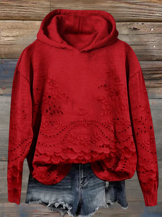 Sweat à capuche rouge, broderie florale et ourlet festonné