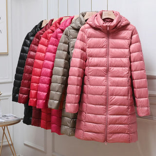 Doudoune ultralégère rose à capuche, matelassée, fermeture zippée.
