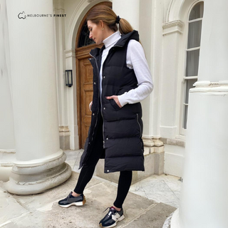 Manteau long sans manches Francesca™ noir matelassé, col montant, poches et boutonnage