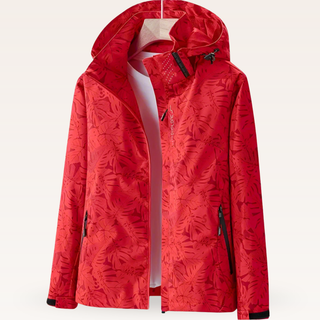 Veste de rafraîchissement rouge à capuche, fermeture zippée, motif feuillagé.