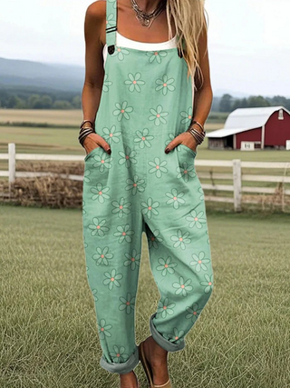 Combinaison vert menthe à bretelles, pantalon ample, fleurs multicolores, poches