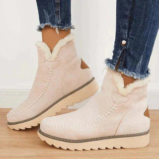 Bottes d’hiver pour femme beige à plateforme, tige cheville et intérieur fourré moelleux.