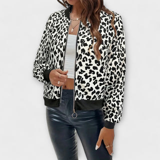 Veste zippée imprimé léopard blanc et noir, col montant, fermeture éclair, manches longues.