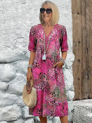 Sofia | Robe midi florale élégante avec couverture du ventre