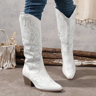 Bottes de cowboy blanches à talon bloc, bout pointu, motifs façon western.