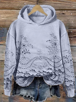 Sweat à capuche bleu clair, broderie florale et ourlet festonné