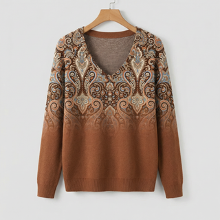 Pull à manches longues en maille marron, encolure en V et motif cachemire sur le haut.