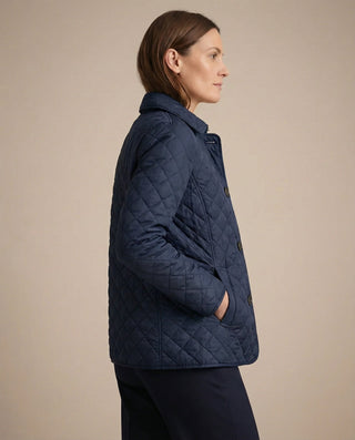 Veste matelassée boutonnée bleu marine, vue trois-quarts dos, manches longues