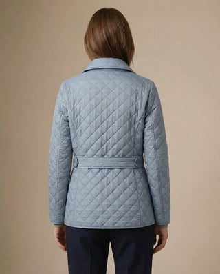 Veste matelassée boutonnée bleu clair, vue de dos avec ceinture à nouer