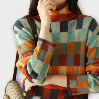 Pull à col rond à carreaux multicolores avec poignets et col côtelés.