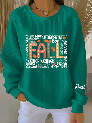 Sweat-shirt femme vert à col rond, motif graphique citrouille et texte imprimé au centre
