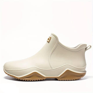 Botte cheville à enfiler beige clair, bout rond et semelle crantée couleur caramel.