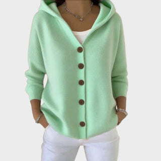 Cardigan en tricot vert menthe à capuche, ouverture boutonnée, finitions côtelées aux manches.