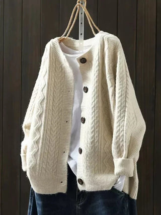 Cardigan en tricot beige à gros maillons, fermeture boutonnée sur le devant