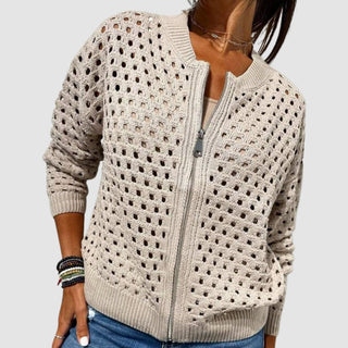 Gilet zippé en tricot ajouré beige, zip au centre, manches longues.