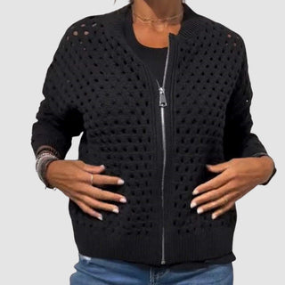 Gilet zippé en tricot ajouré noir, col montant, manches longues.