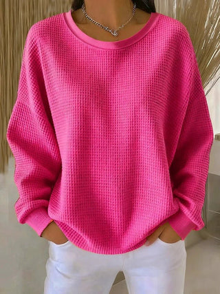 Pull long femme en tricot gaufré fuchsia, manches longues, col rond.
