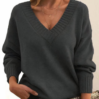 Pull femme gris foncé en tricot, col V côtelé, manches longues bouffantes, poignets côtelés