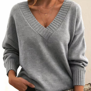 Pull femme gris clair en tricot, col V côtelé, manches longues bouffantes et poignets côtelés